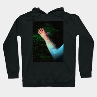 Digital collage and special processing. Ugly close up, amazing on distance. Hand, water view. Dark green water. Hoodie